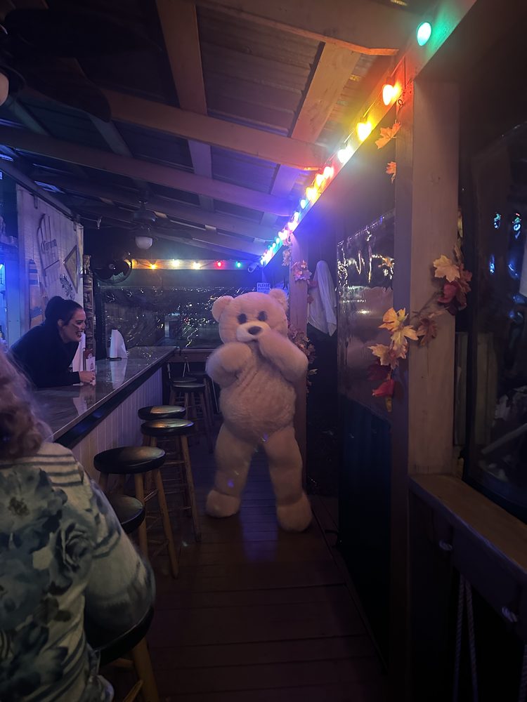 A giant teddy bear greeting guests at the Tiki Bar